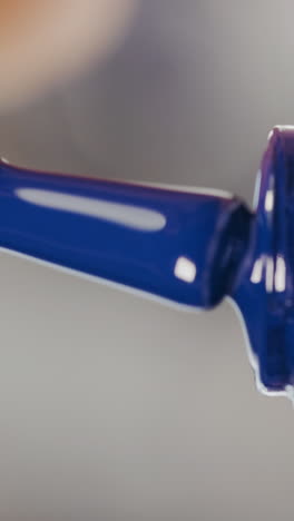 close-up of dropping blue nail polish