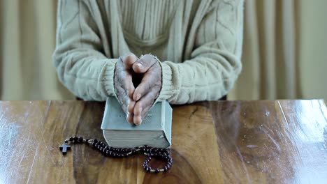 praying-to-God-with-bible-faithfully-worshipping-with-people-stock-footage-stock-video