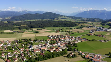 small and simple village of forel in swiss countryside switzerland - aerial shot