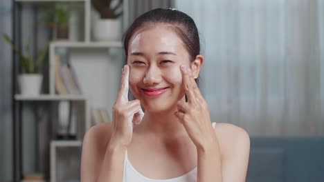 woman applying face wash