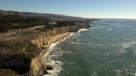 the abandoned remains of the davenport pier, california coast, drone 4k