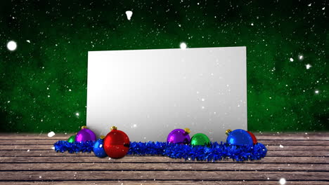 Animation-of-snow-falling-over-white-card-with-copy-space-and-christmas-decorations