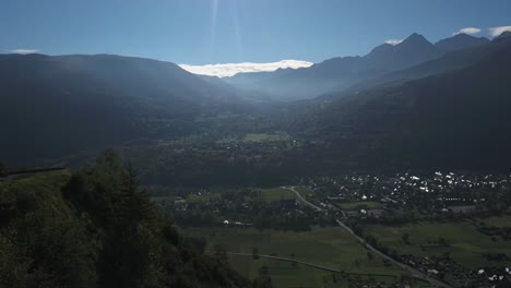 Valley-with-snow-capped-mountain-in-background,-view-from-Col-de-Portet-mountain-pass-in-French-Pyrenees,-France