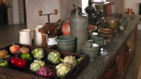 vintage kitchenware and fruits on an antique table