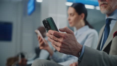 People Waiting and Using Smartphones