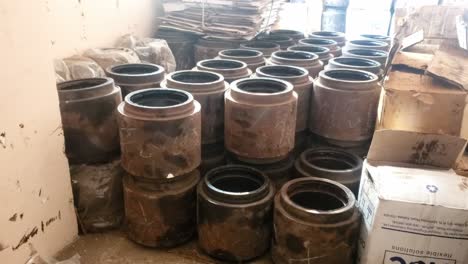 the video shows a storage area with multiple large cylindrical objects, which appear to be railway train wheelset bearings