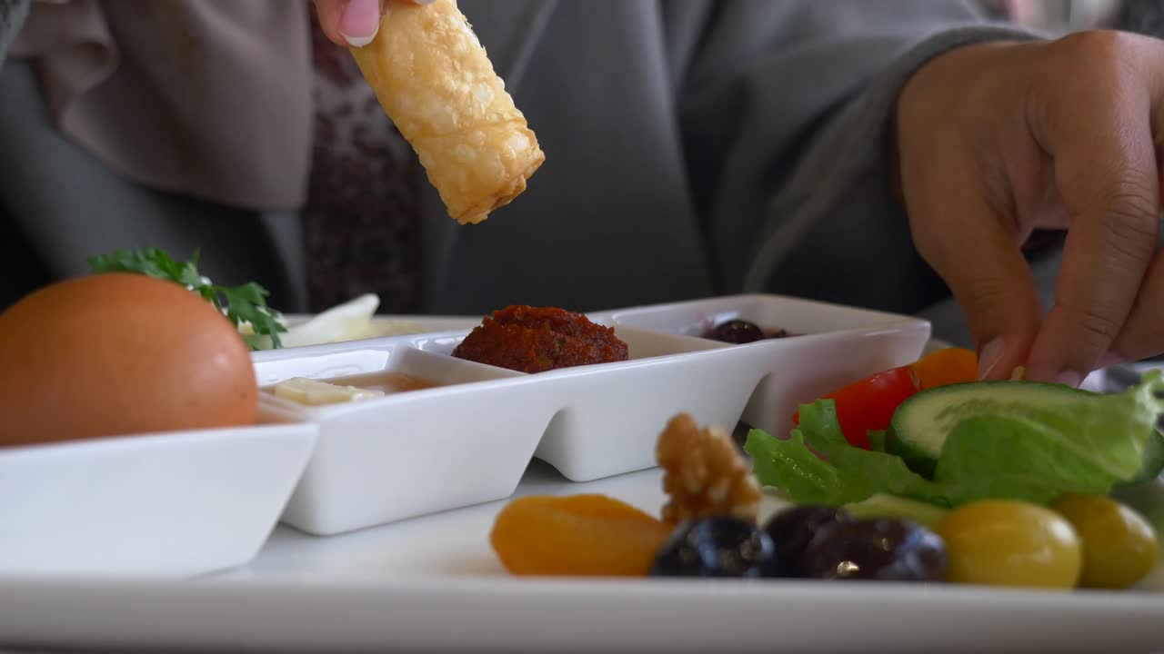 Breakfast Platter with Egg, Cheese, Vegetables, and Pastries