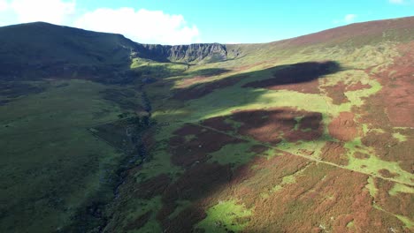 coneragh mountains waterford ireland drone flying to the tay valley in the dappled light of sunset on a summer evening