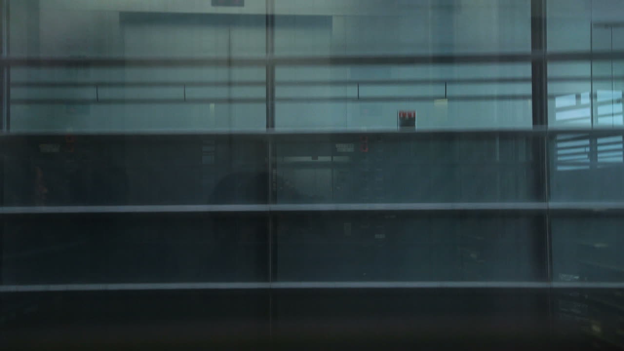 Moving elevator in modern office building.