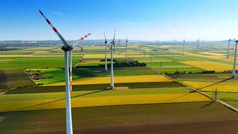 turbines powering rural europe. wind turbines stand tall over expansive fields, harnessing renewable energy in a picturesque european landscape