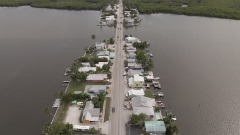 Aerial-tracks-Pine-Island-Rd-in-manufactured-community,-Matlacha,-FLA