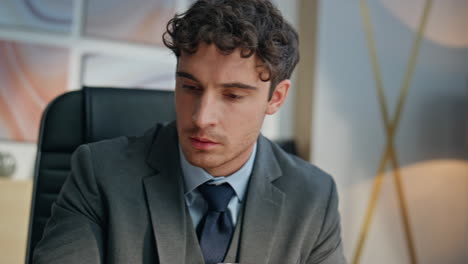 focused businessman working office with coffee cup closeup. boss writing notes