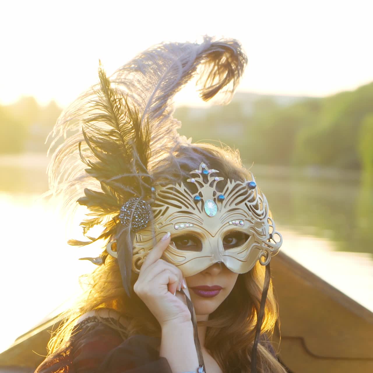 Beautiful woman riding on gondola. Girl is swimming in a boat