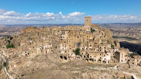 the deserted village of craco in the province of matera, basilicata, southern italy. aerial drone shot