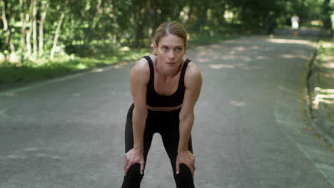 woman resting during workout in park