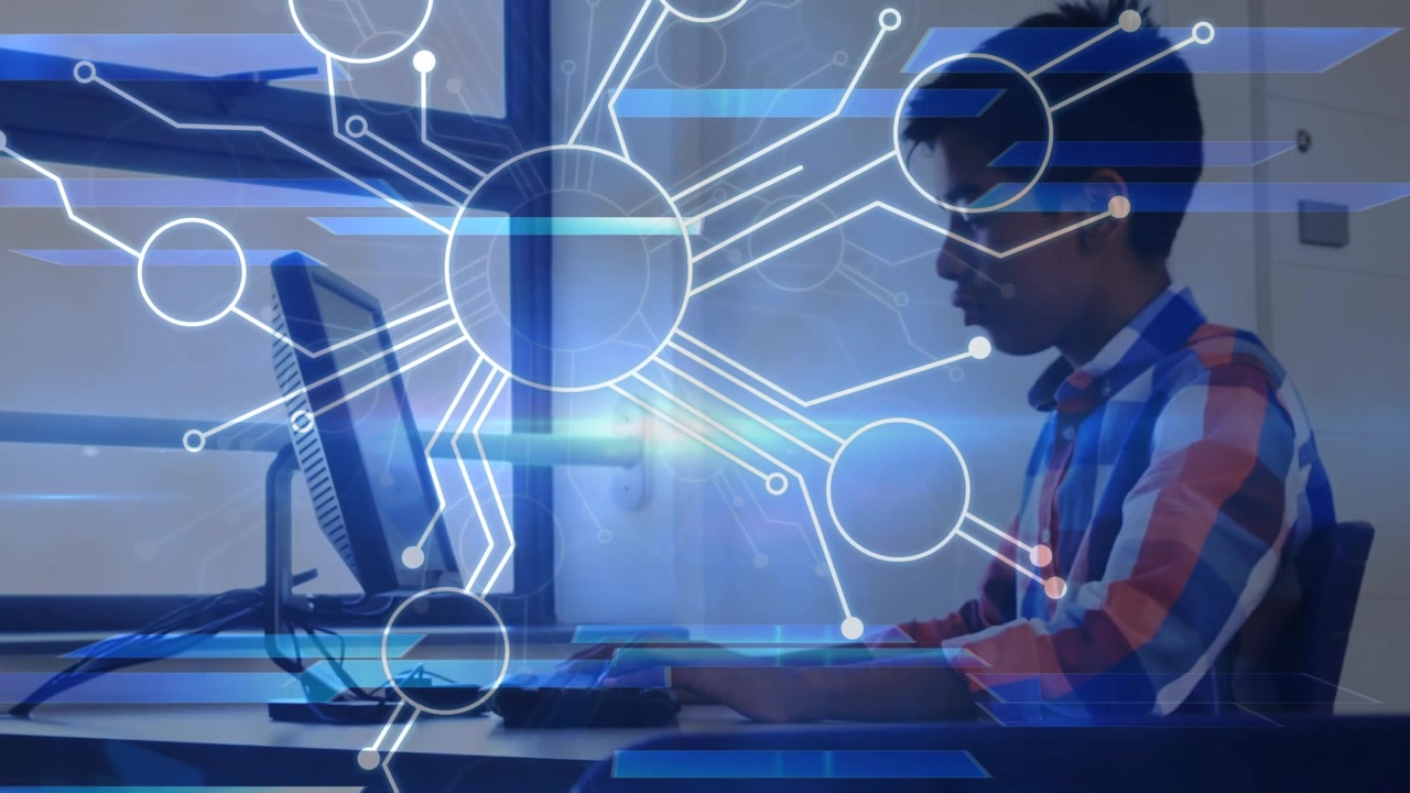 Young Man Working on Computer with Digital Network Overlay