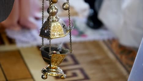 smoking device in the middle of the ritual. close-up slow motion footage of a smoking device in the middle of the ritual in the middle of the church