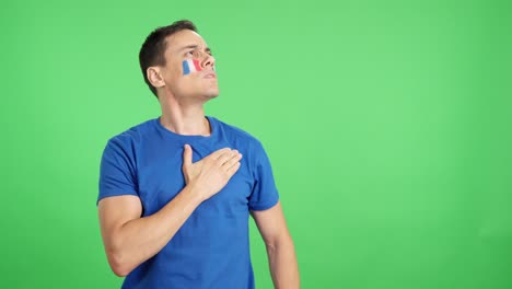 French patriot listening to the national anthem with solemnity