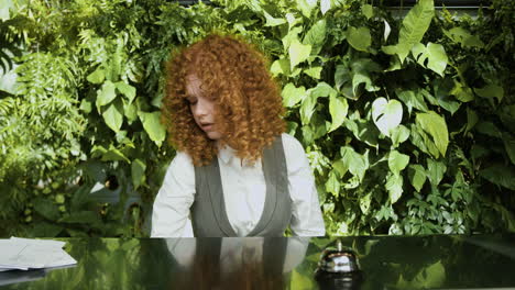 redheaded receptionist behind the counter