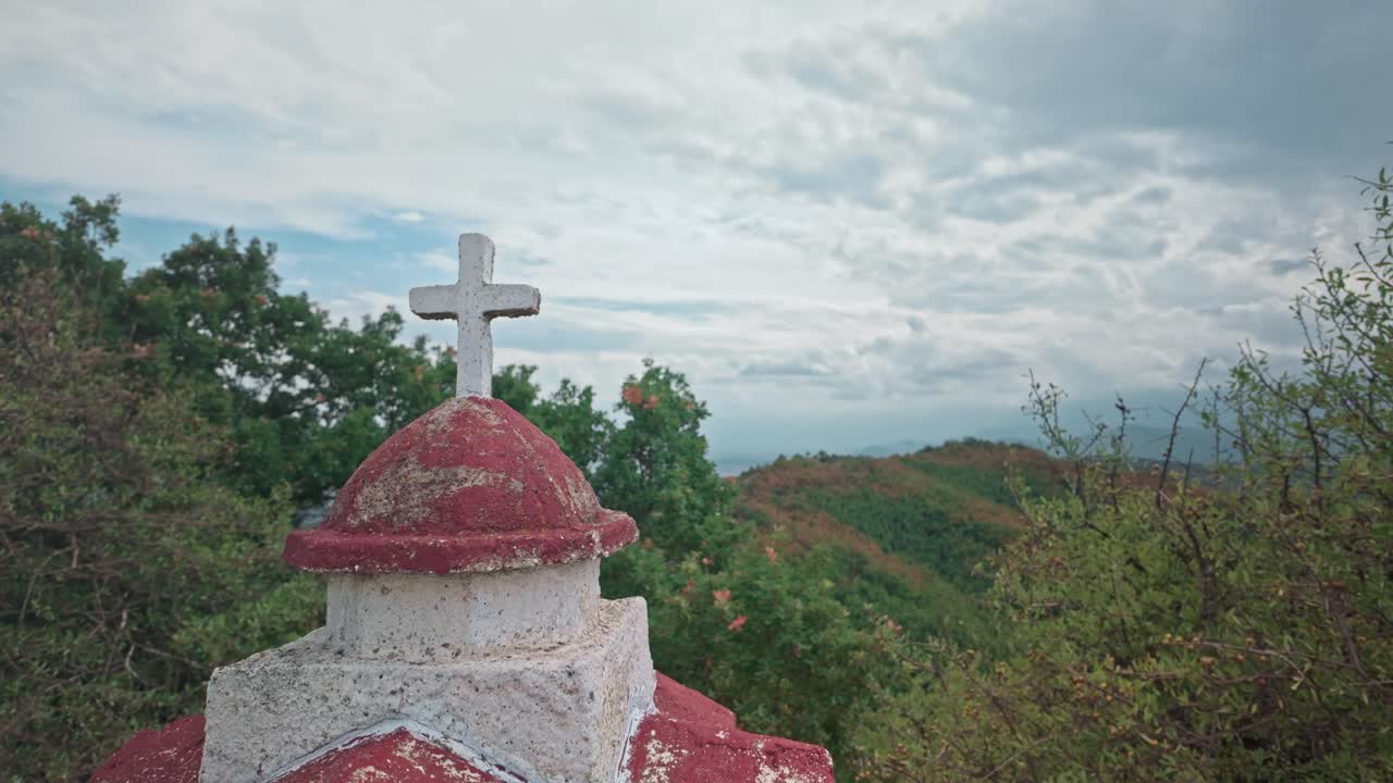 Serene Mountain Landscape with a Cross