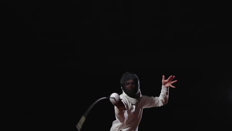 fencer in action during a competition