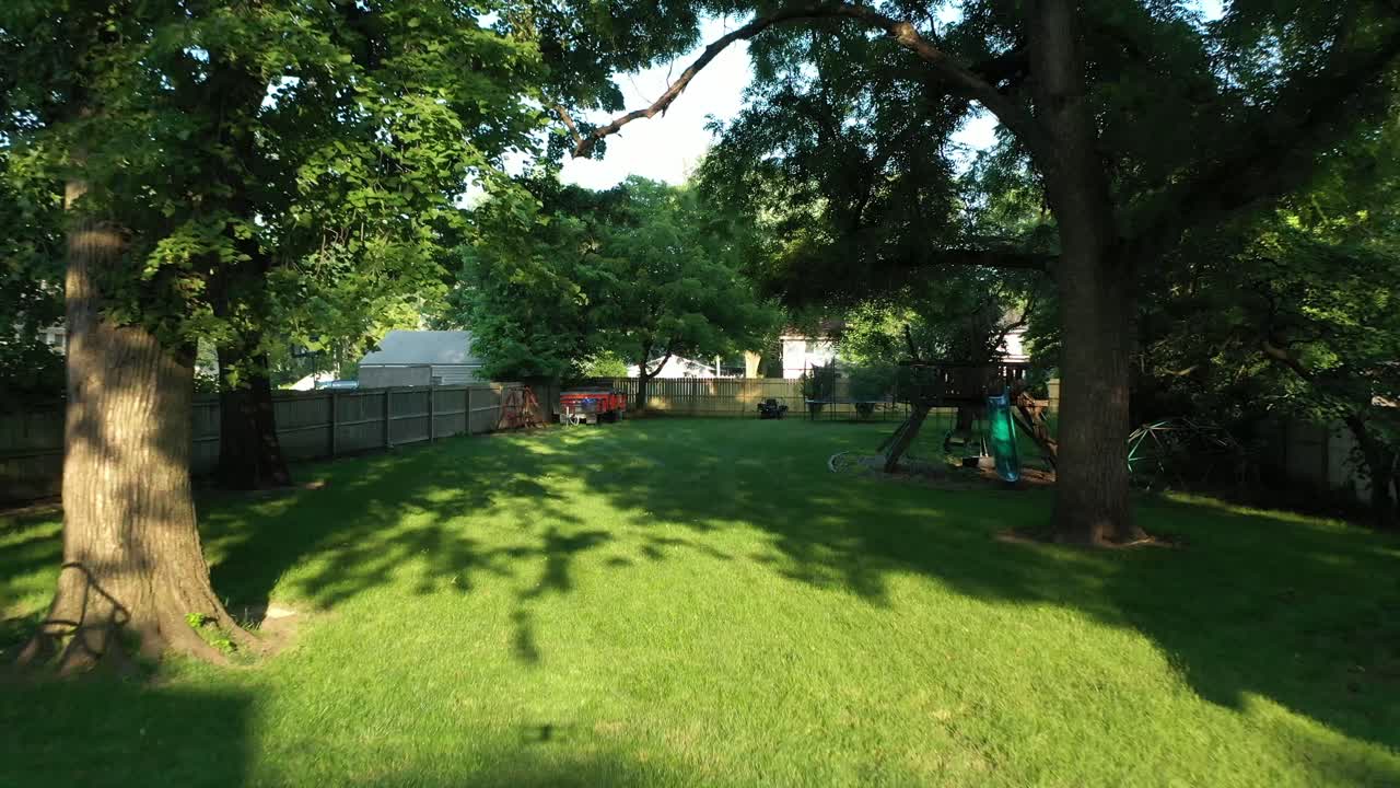 Drone shot of an Iowa backyard job site prior to tree trimming