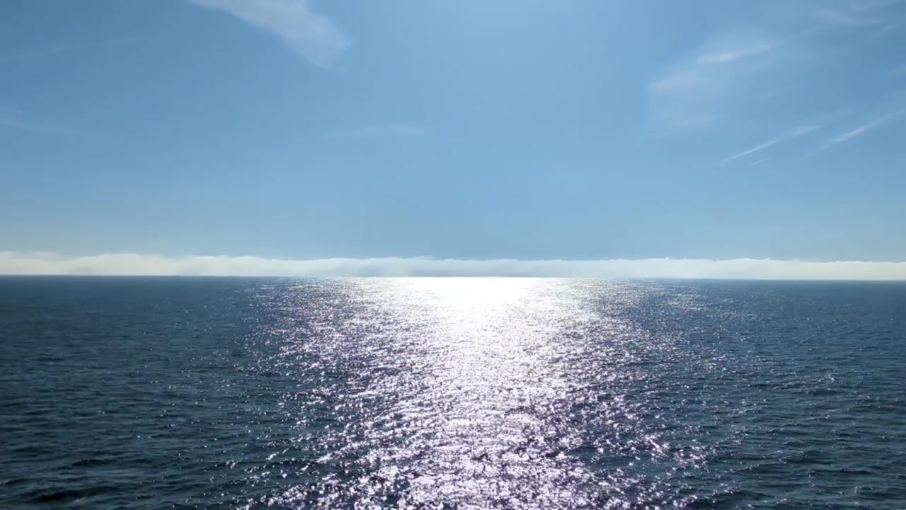 Open Ocean Sun Reflection on Calm Blue Water During Bright Sunny Day