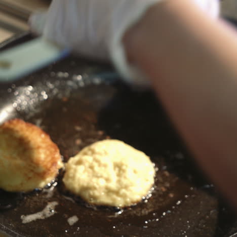 preparation of golden crispy potato pancakes in a frying pan. vegetable pancakes. sqare video