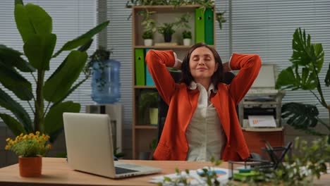 businesswoman relaxing in office