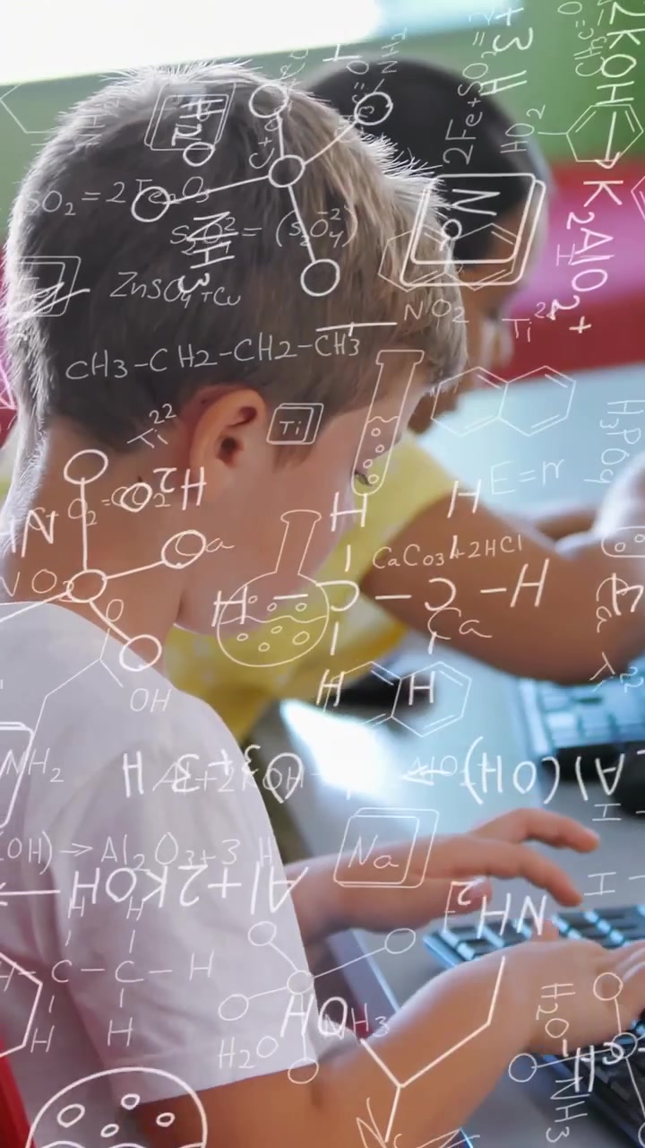 Vertical video: Foreground student typing on keyboard, generating chemistry overlays for class task