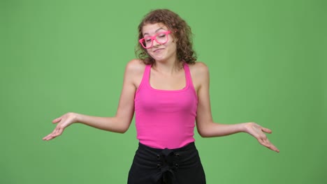 young confused nerd woman shrugging shoulders