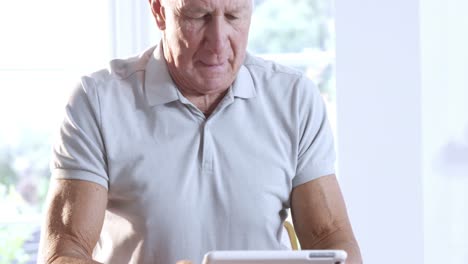 Senior-man-using-tablet