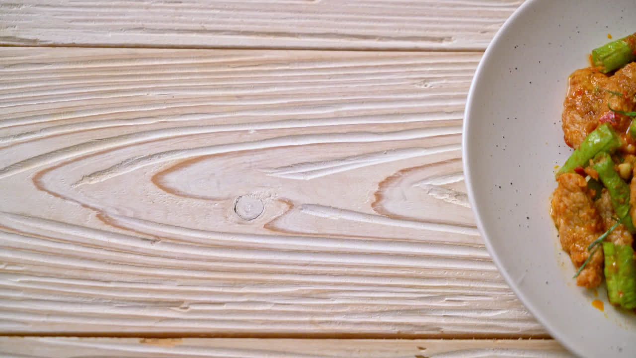 Stir fried pork and red curry paste with sting bean - Asian food style