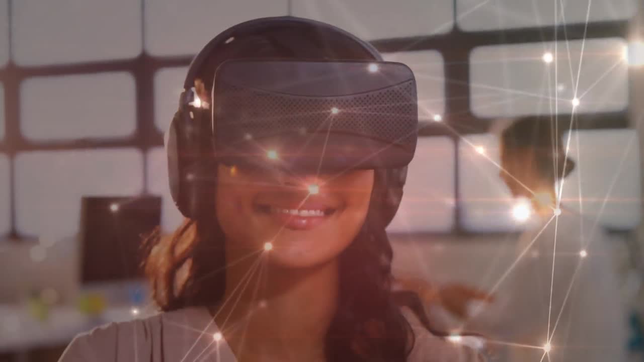 Animation of digital interface over businesswoman using vr headset