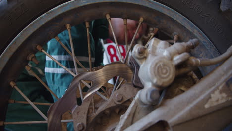 mechanic repairs a cross bike