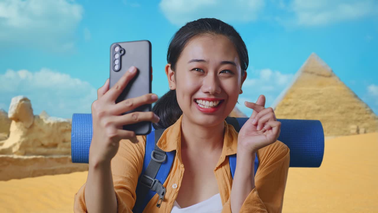 Close Up Of Asian Female Hiker With Mountaineering Backpack Taking A Selfie While Traveling In Pyramid Of Giza