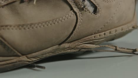 close dolly of worn sole of hiking shoe