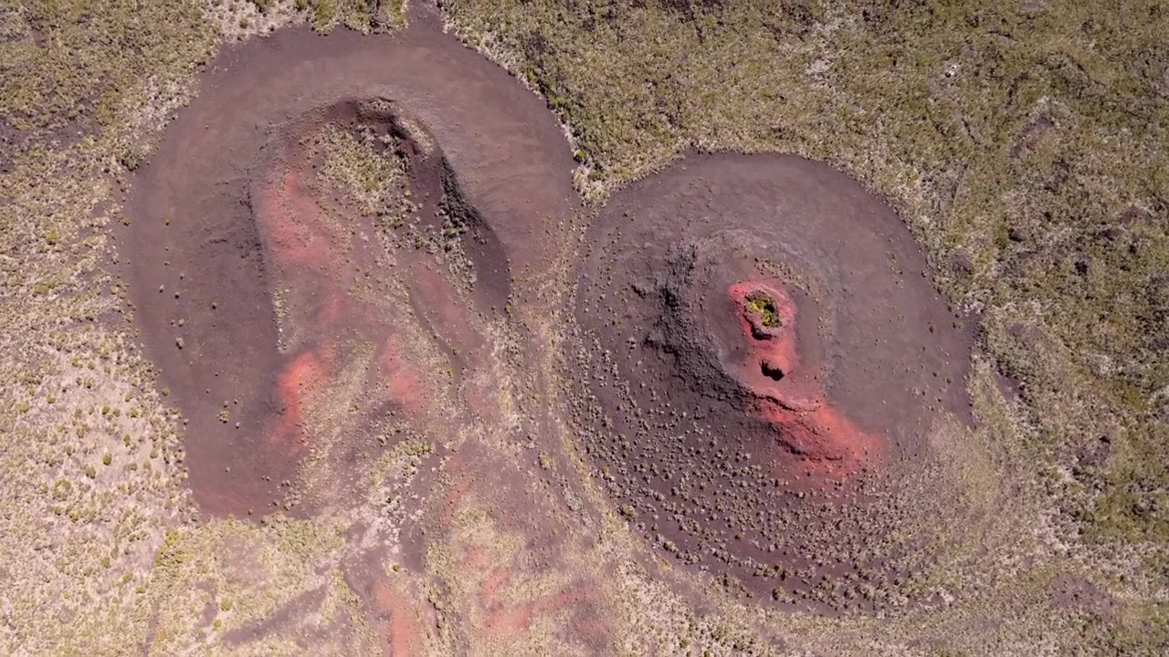 France, Réunion Island, Puys Ramond Craters. Aerial view of volcanic formations.Two types of craters.