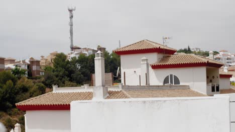 slow motion trucking shot of typical mediterranean rooftops in spain