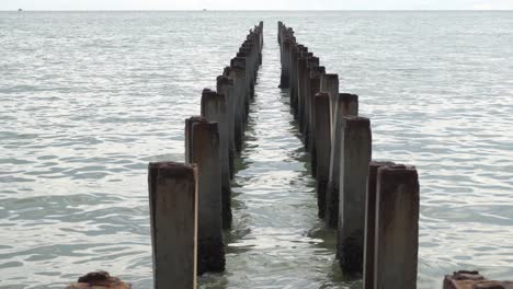 abandoned broken pier at sea