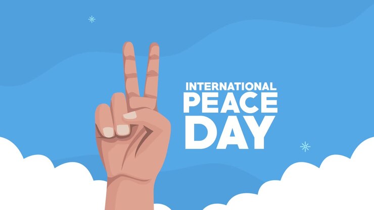 international peace day lettering with hand signal