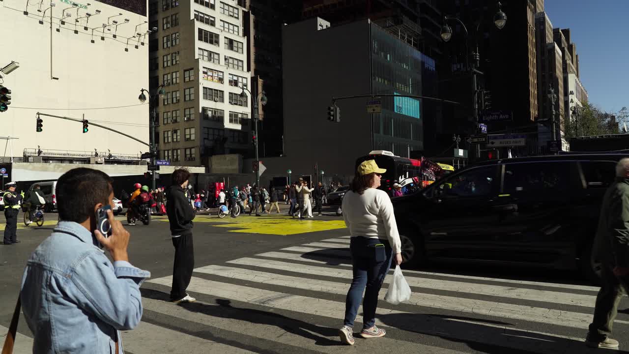 As the sun shines brightly, crowds of people fill the streets near Madison Square Garden, united in their support for Trump