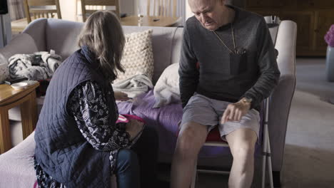 elderly couple sitting in living room