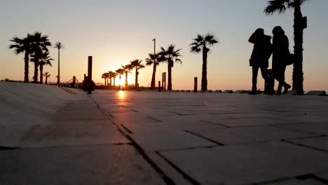 People-walking-on-a-beautiful-sunset