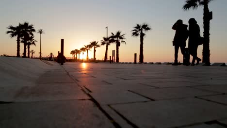 people walking on a beautiful sunset