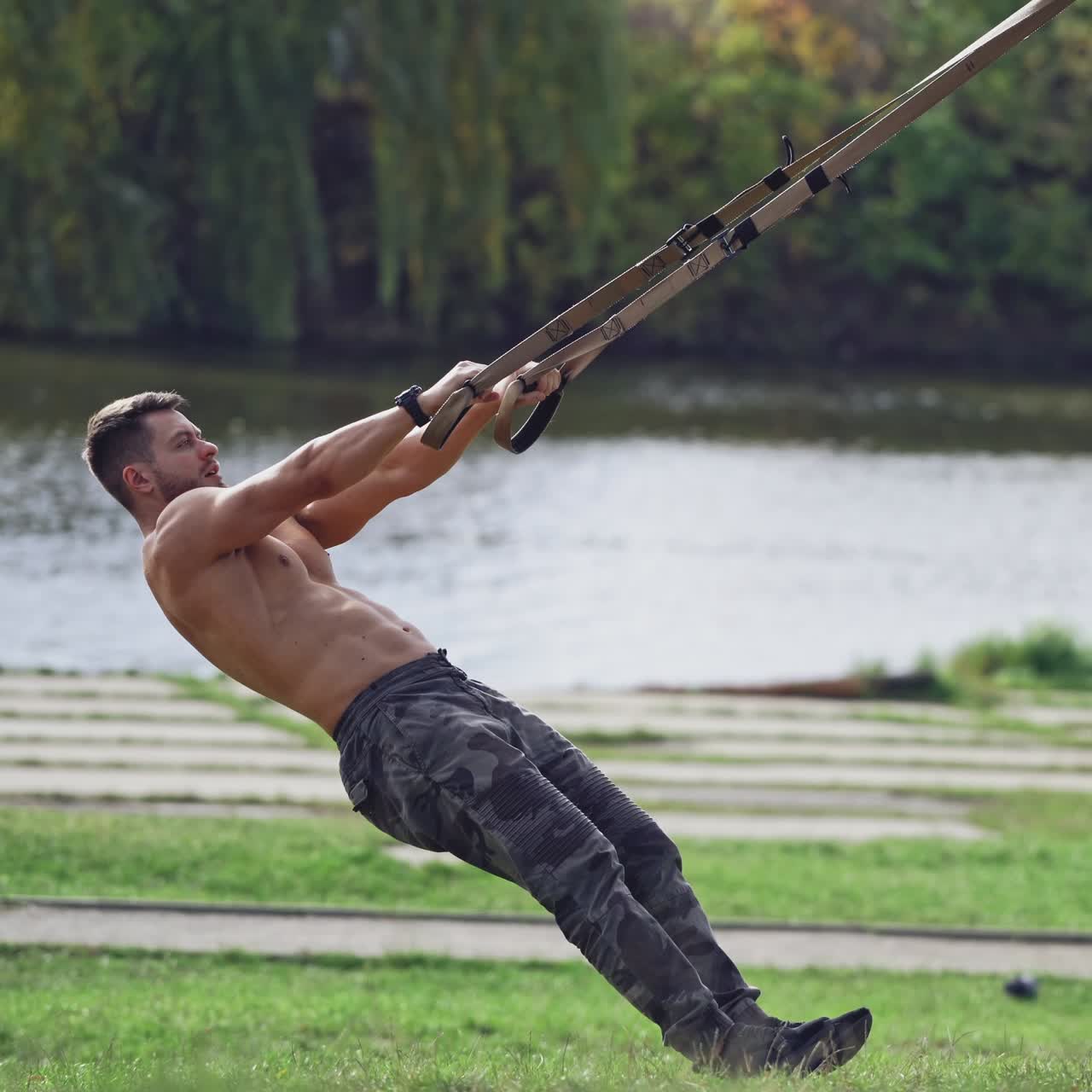 . Fitness man doing push ups workout. Handsome muscular man training outdoor