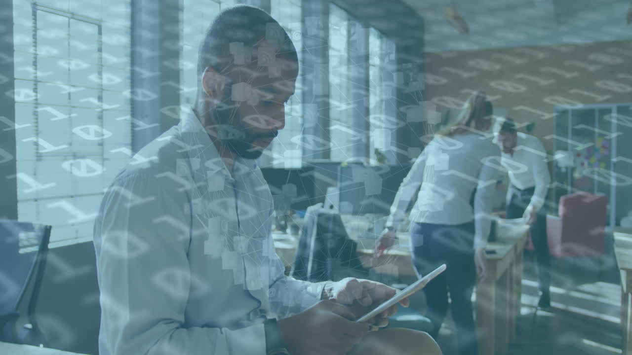 Animation of data processing over african american businessman using tablet at office