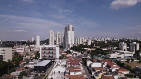 Drone-flying-in-a-beatifull-sunny-day-in-São-Paulo,-Brazil-Blue-sky-and-buildings-as-the-landscape-of-a-big-city