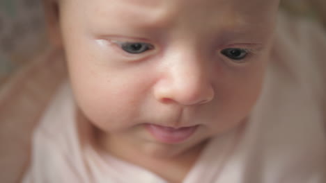 newborn baby girl making faces