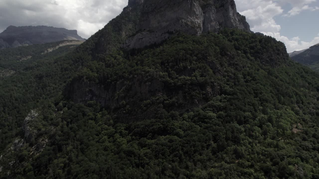 4K crane-up drone shot over the mountains of Hecho Valley in the Western Valleys Natural Park, Aragonese Pyrenees, Spain. A stunning aerial ascent revealing the rugged alpine landscape.